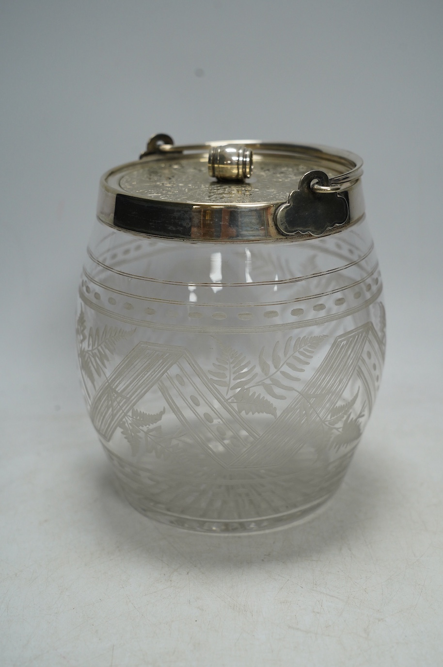 An electroplate mounted glass biscuit barrel, 16cm. Condition - fair to good